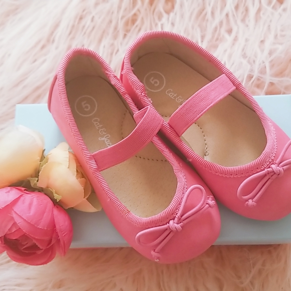 Cat & Jack pink shoes and H&M black shoes